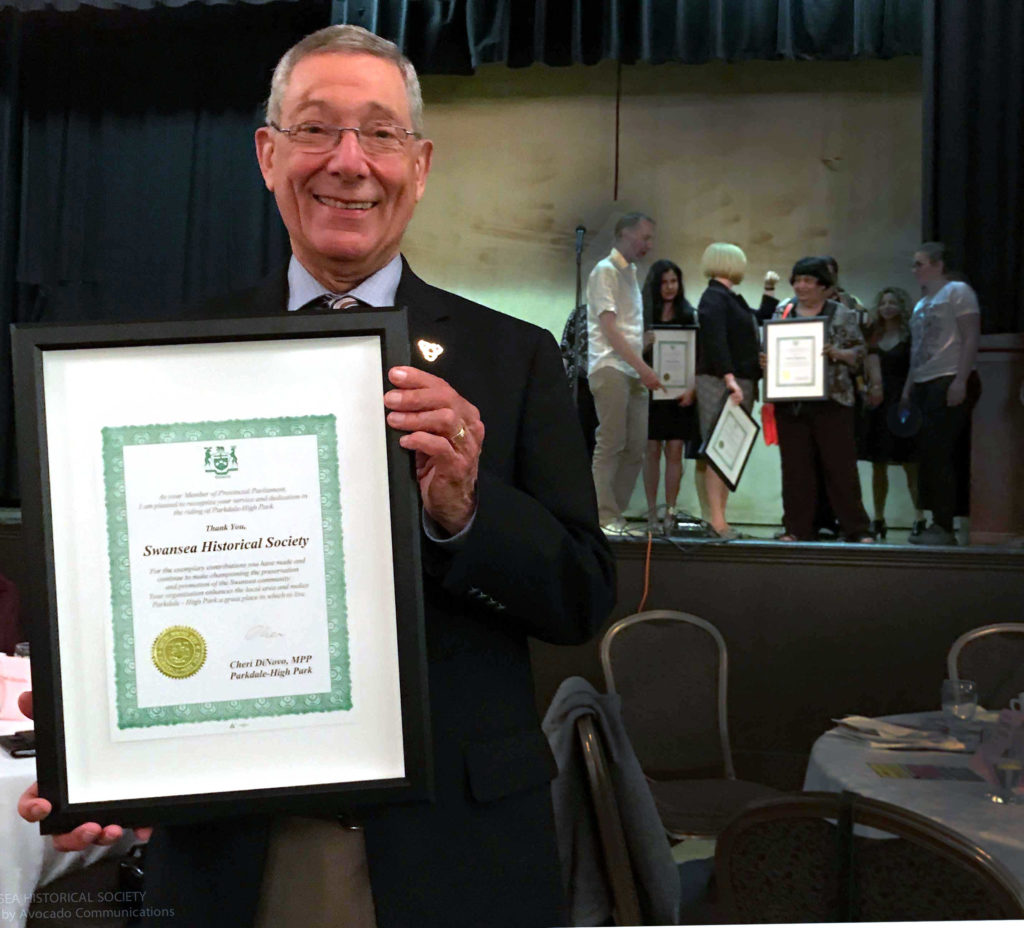 Bob Roden, President of Swansea Historical Society with the 2017 Community award from then Ontario MPP, Cheri DiNovo.