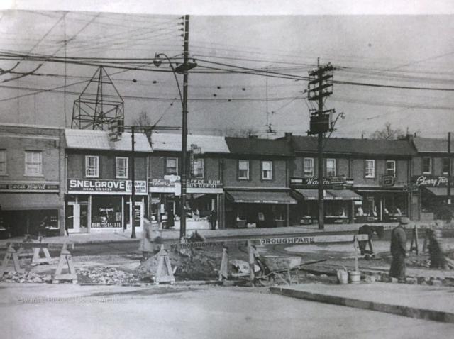 Looking north from the TTC Jane loop at Jane and Bloor sometime in the early 1950s. Cecil Ward and Sons menswear (left) opened in Bloor West Village in 1939 at 2438 Bloor Street West (TD Bank, today). They moved to 2416 Bloor Street West in 1993, where they remain to this day as one of the oldest retail stores in the area. Source unknown.