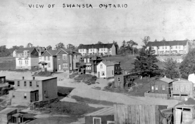 View from a postcard taken near the corner of Durie and Morningside, shows the houses on lower Beresford Ave and Runnymede not yet developed and the back of Rennie's Row on Kennedy. Swansea Historical Society archives.