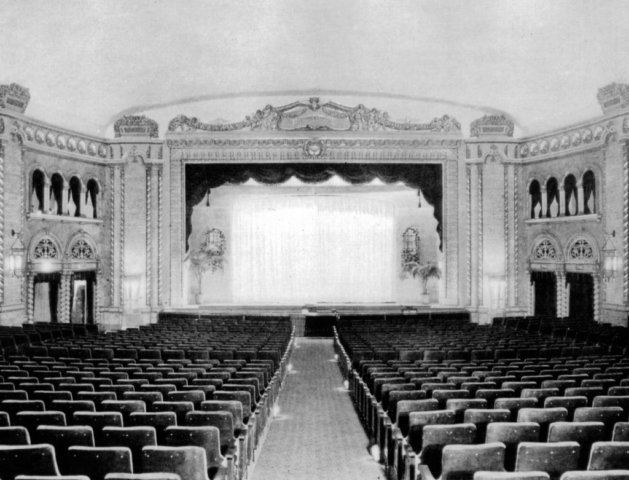 "Canada's Theatre Beautiful," the Runnymede Theatre, as it appeared inside when opened in 1927. It was built in an 'atmospheric' style to simulate open air, with a curved azure blue ceiling surrounded by a simulated garden wall.