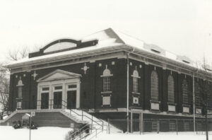 Windermere United Church - Viewed towards NE corner. Roof and steps covered in snow